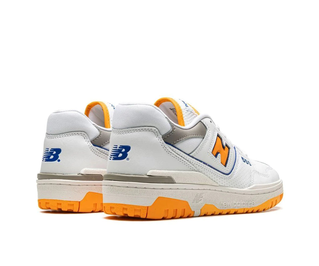 A white leather New Balance basketball shoe with orange and indigo accents.