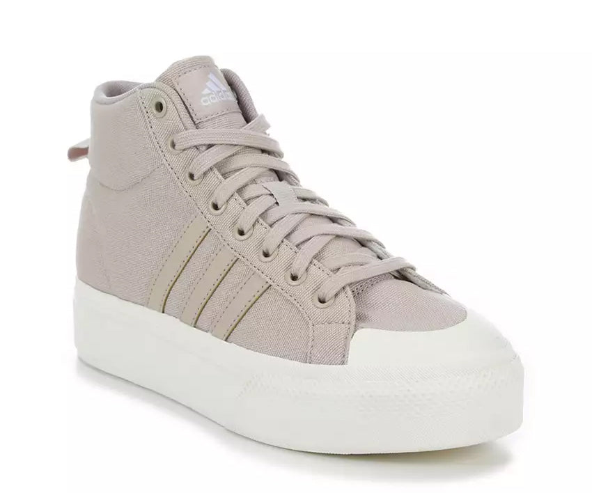 A taupe canvas high-top Adidas sneaker.