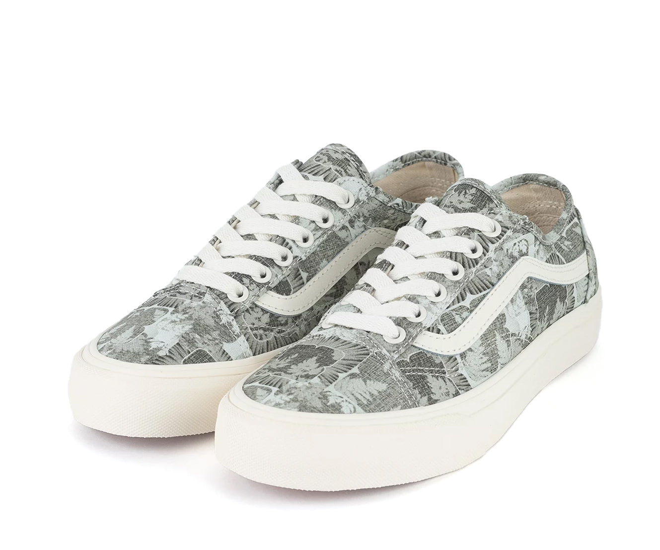 A green floral low-top Vans sneaker.