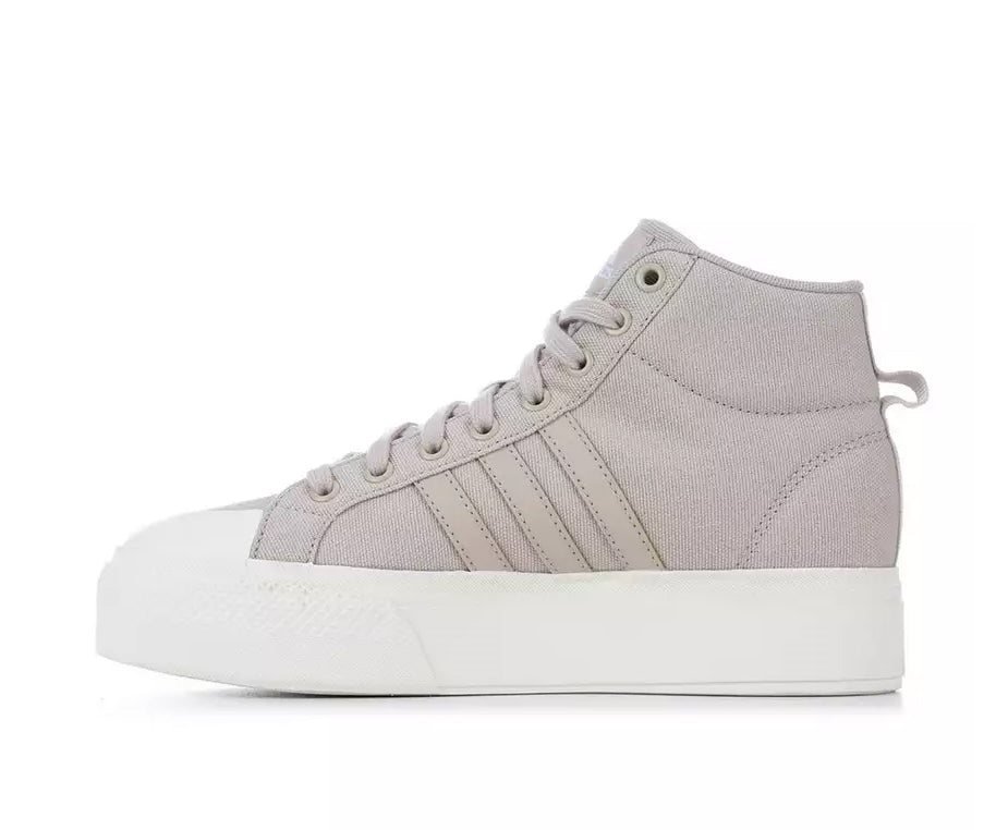 A taupe canvas high-top Adidas sneaker.