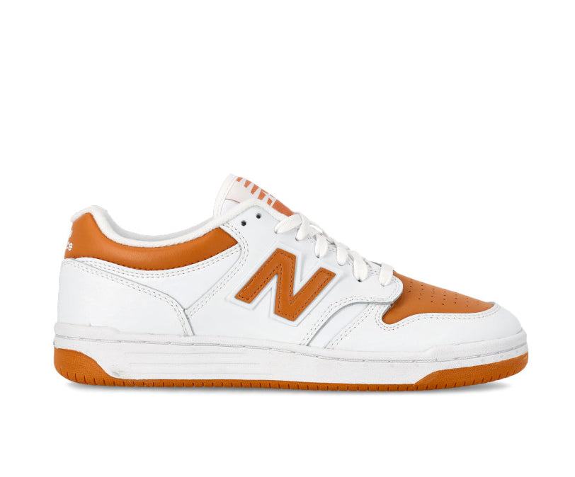 A white and orange leather basketball sneaker from New Balance.