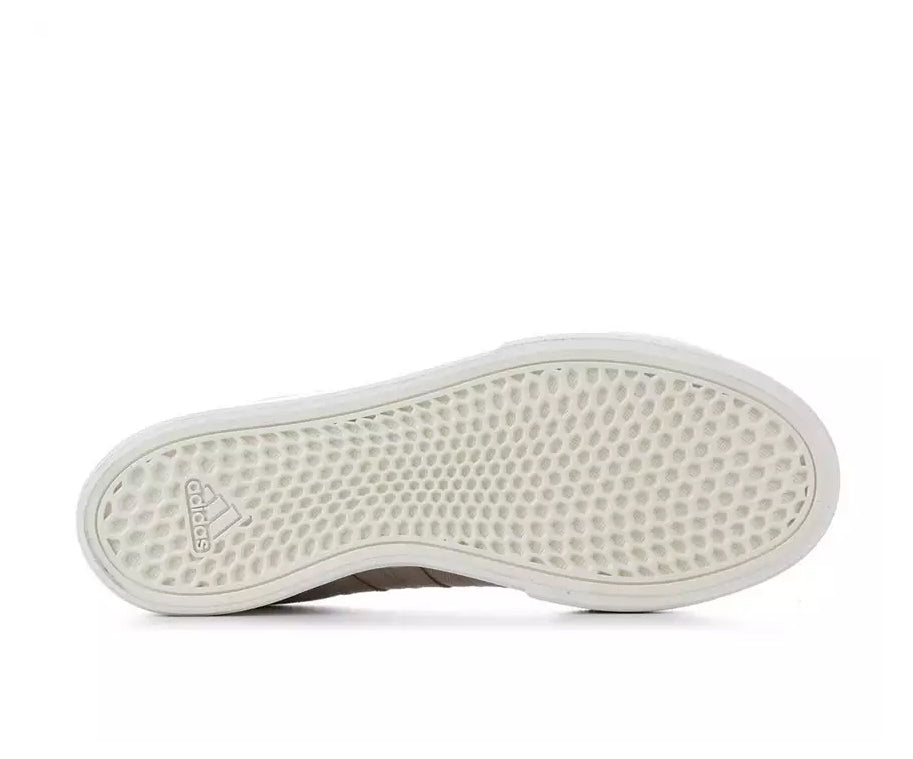 A taupe canvas high-top Adidas sneaker.
