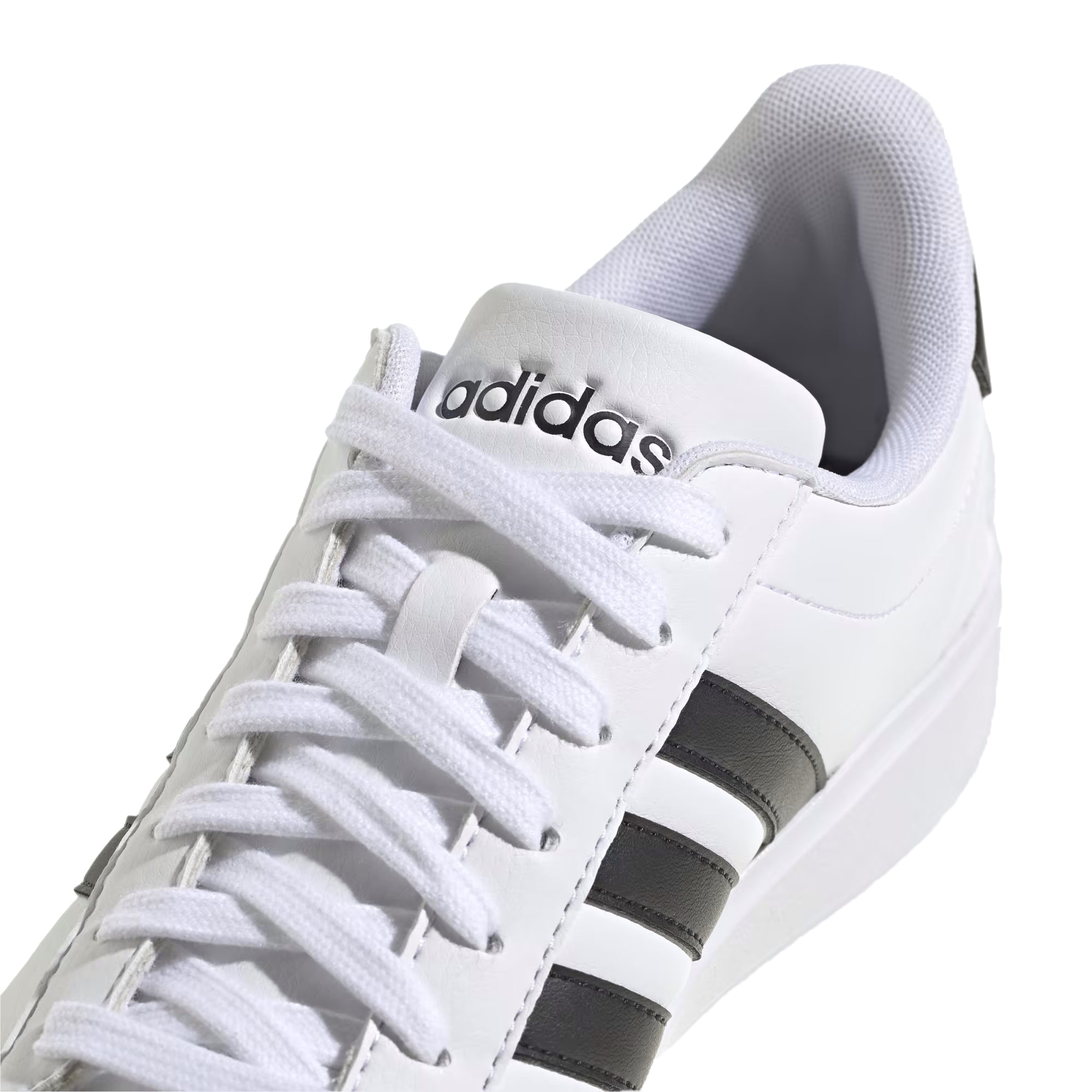 A white leather adidas sneaker with black accents.