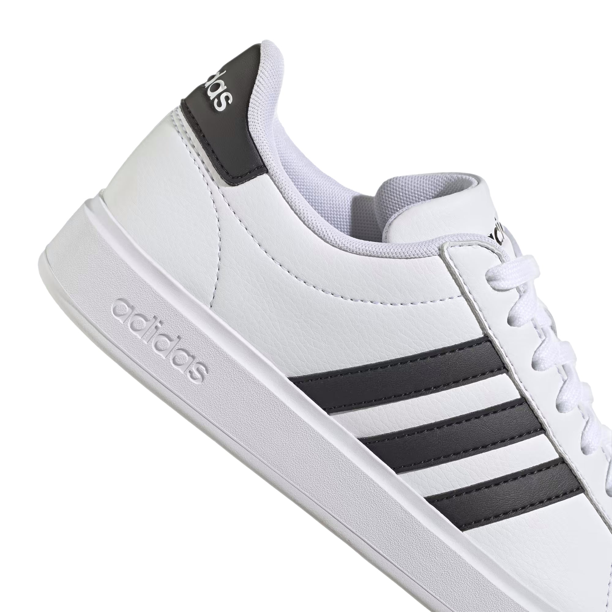 A white leather adidas sneaker with black accents.