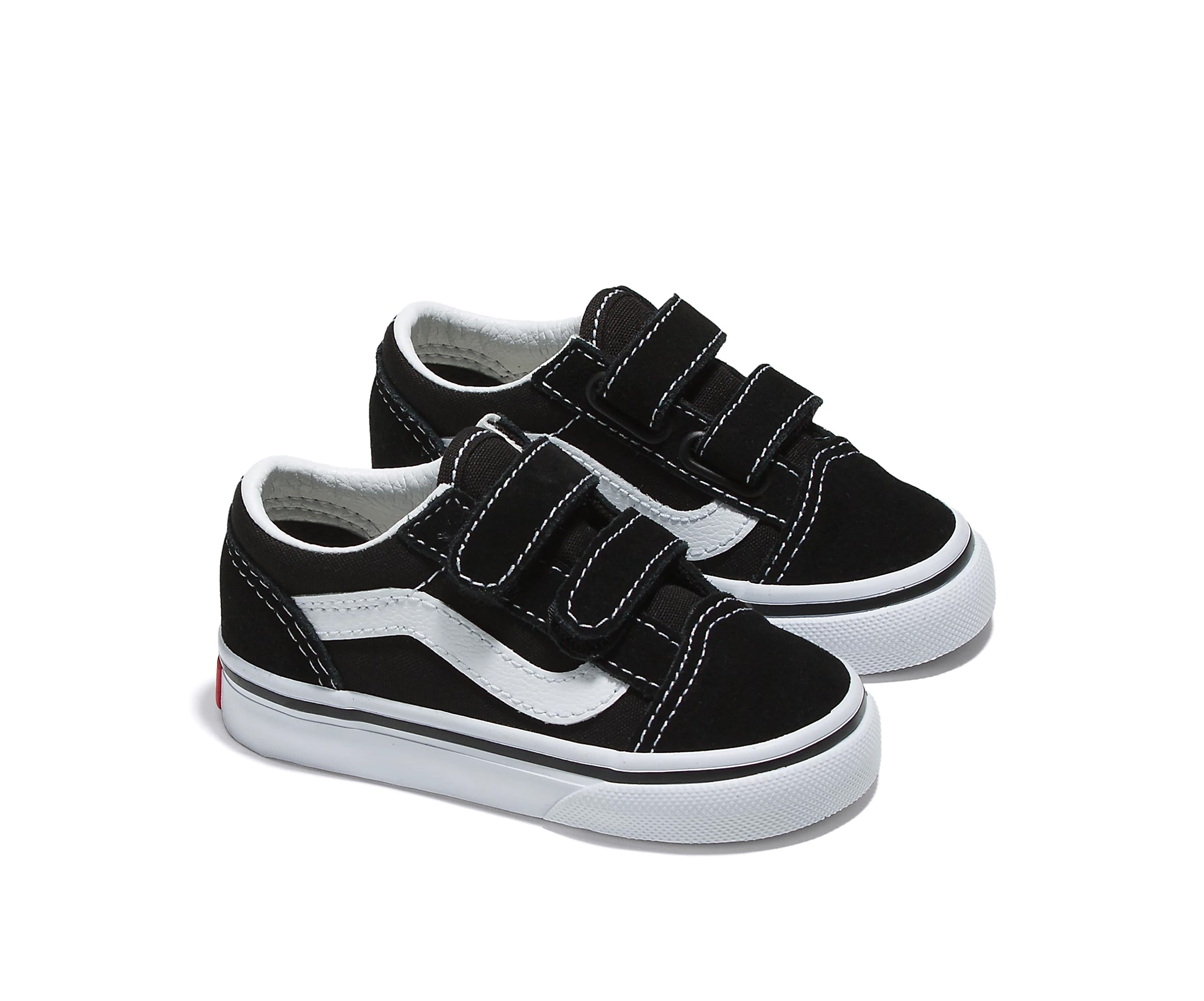 A black canvas and suede kids' sneaker with velcro straps.