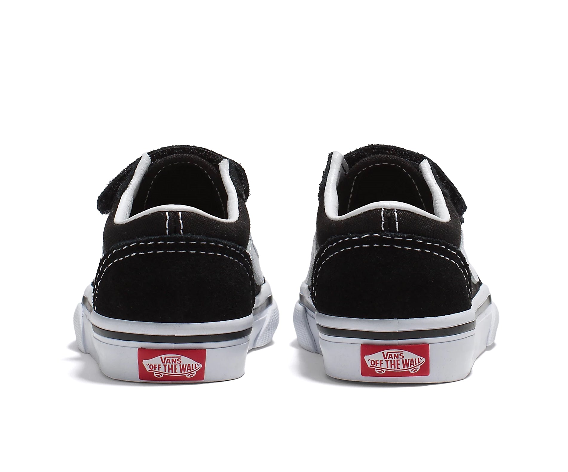 A black canvas and suede kids' sneaker with velcro straps.