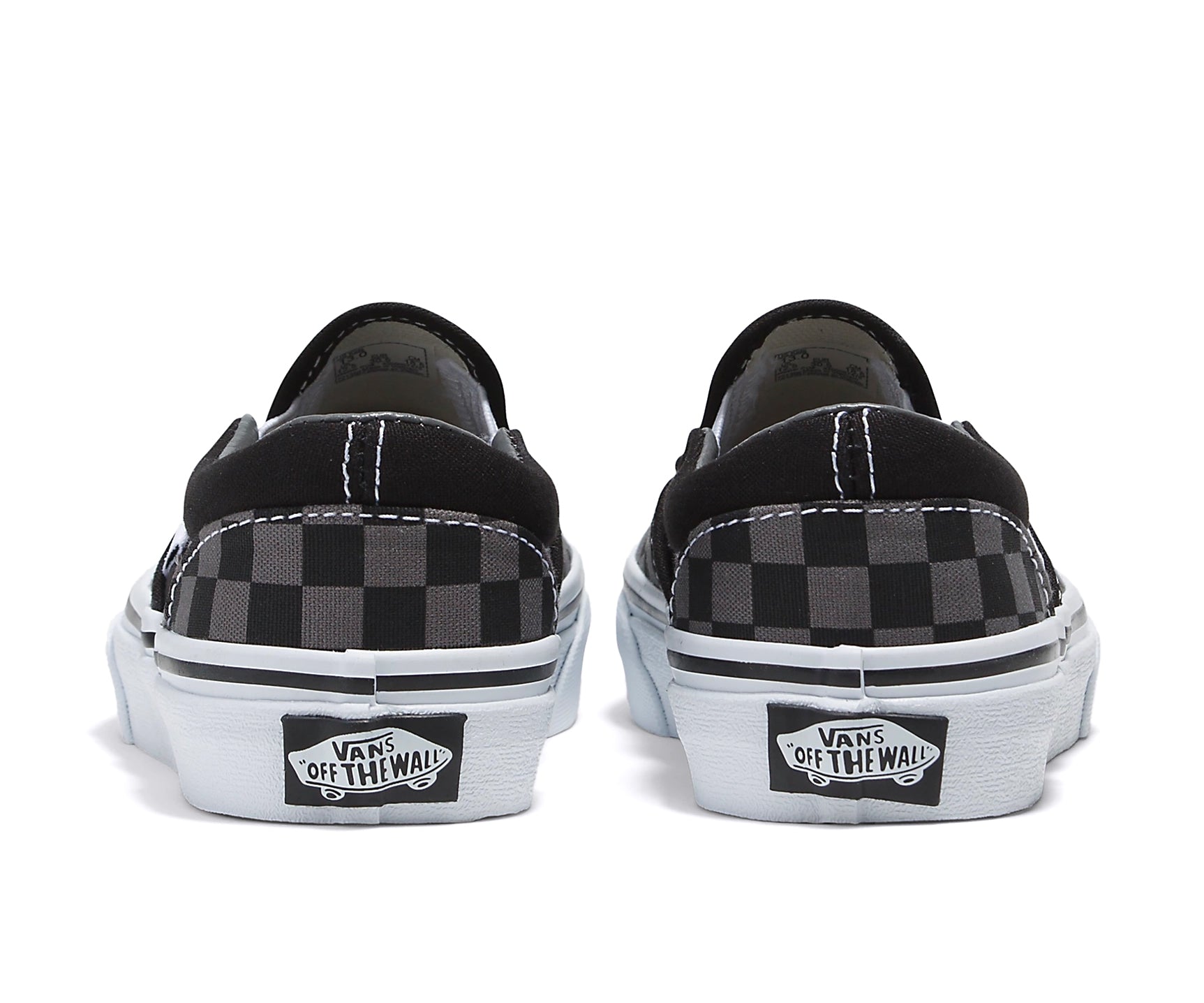 A checkerboard black and pewter canvas kids' slip-on shoe.