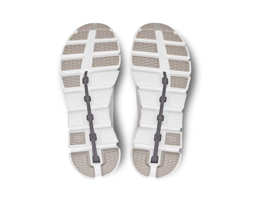 A mesh and rubber white and light yellow running shoe