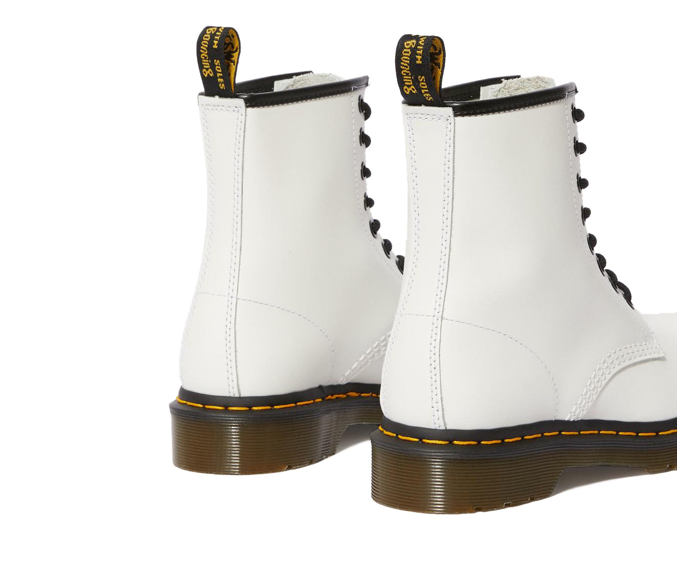 A white leather Dr. Martens ankle boot.