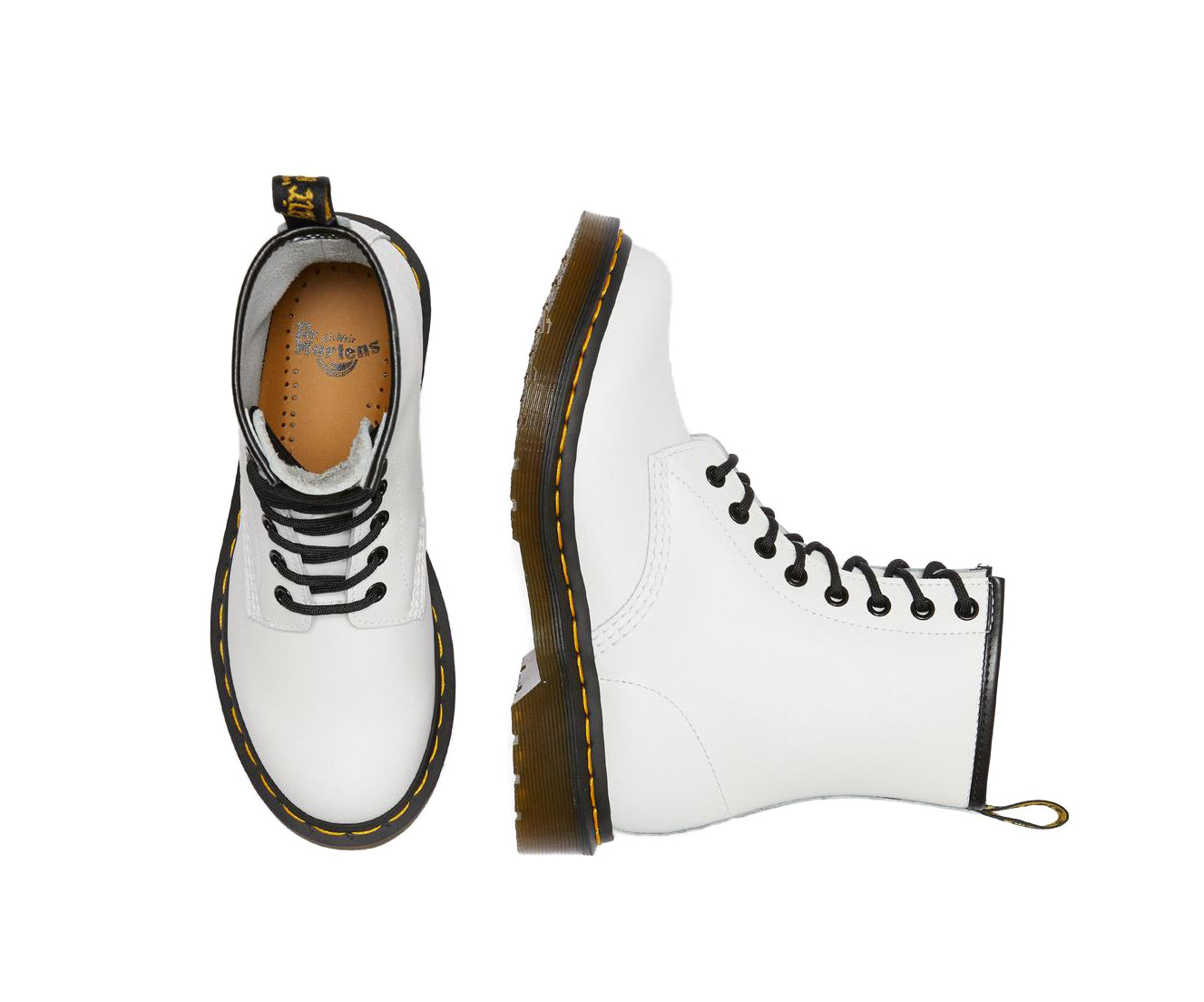 A white leather Dr. Martens ankle boot.