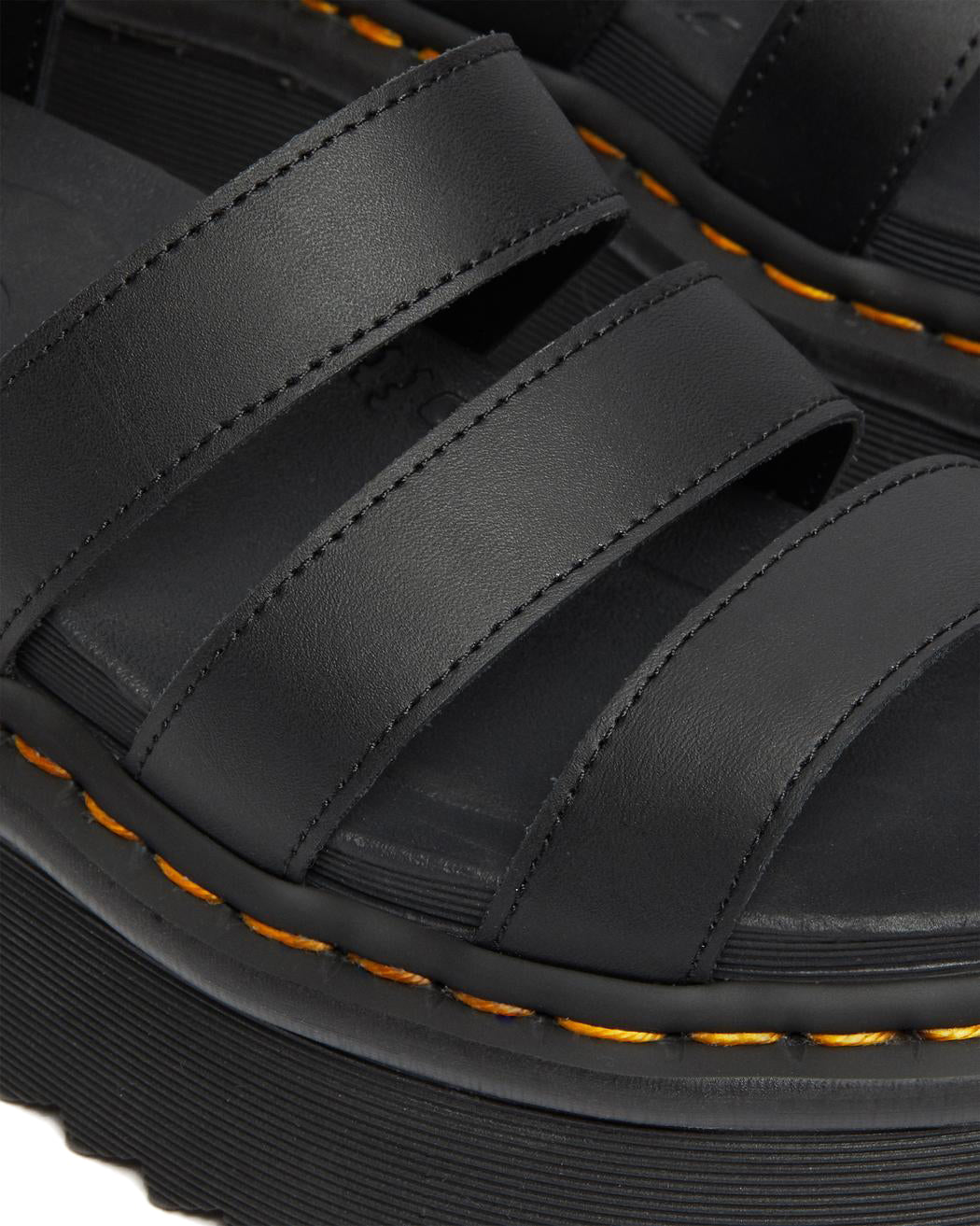 A black platform 3-strap sandal with ankle buckle from Dr. Martens.