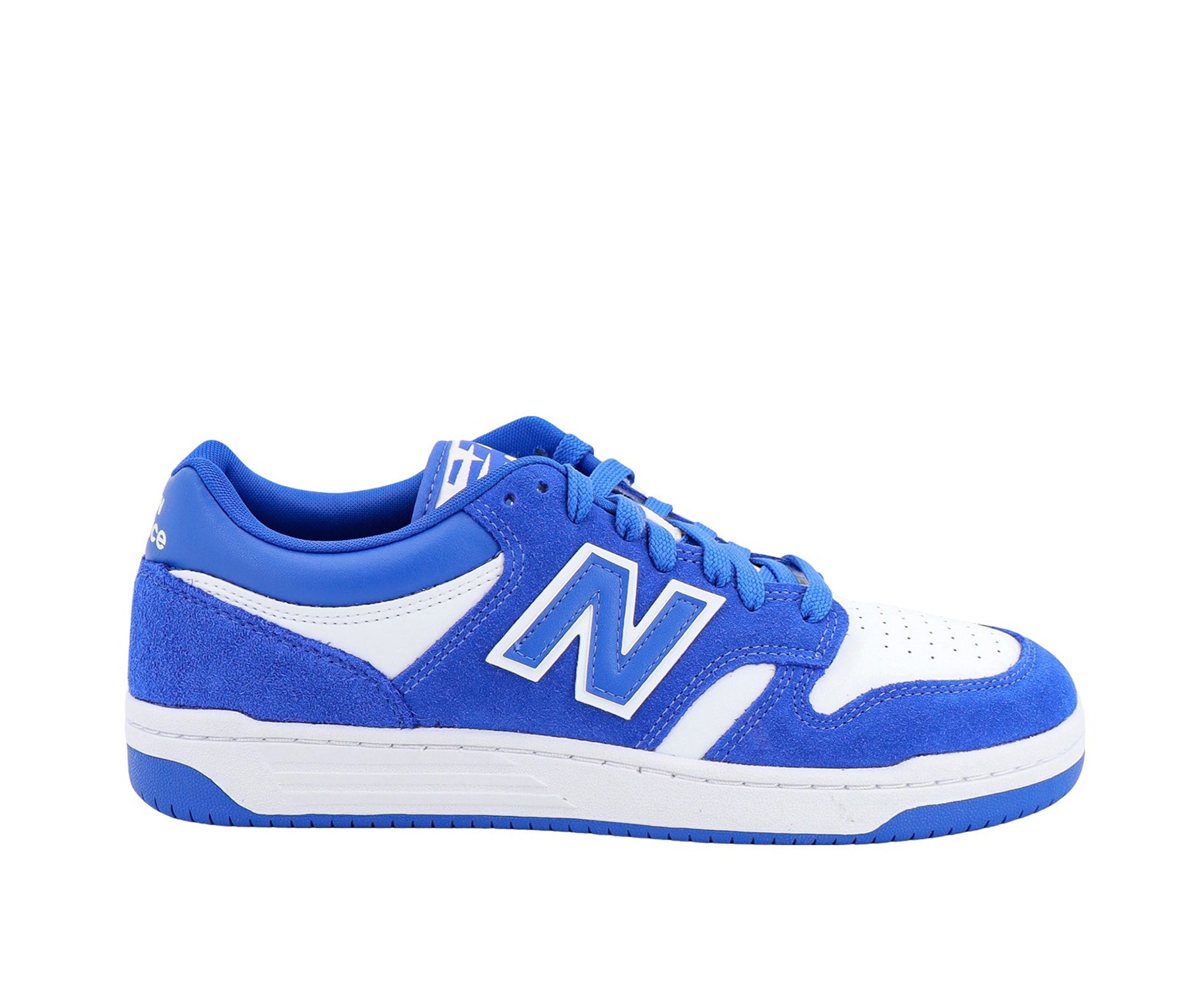 A white leather New Balance basketball shoe with royal blue suede accents.