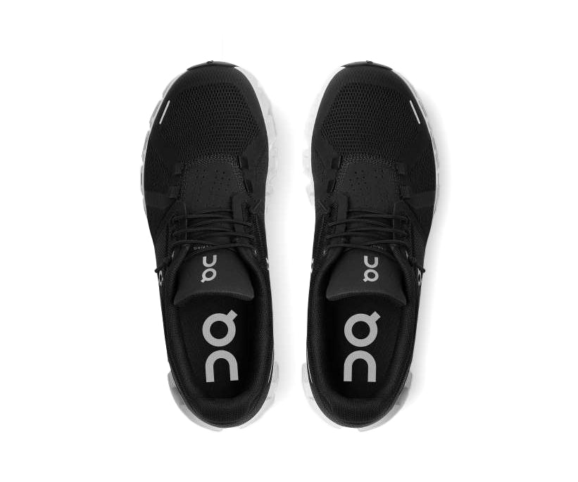 A black sneaker with white accents from On Running.