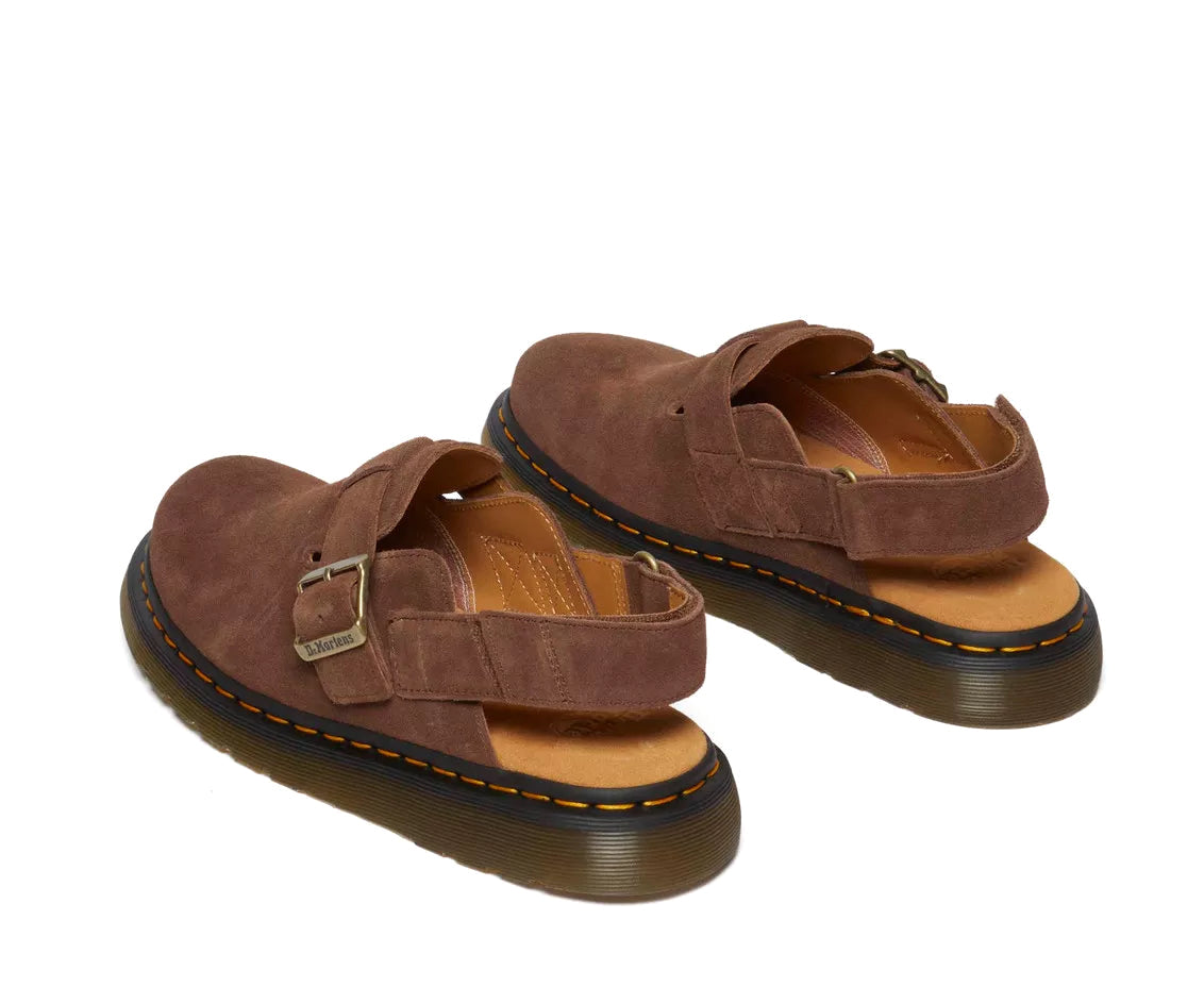 A brown suede mule sandal from Dr. Martens.