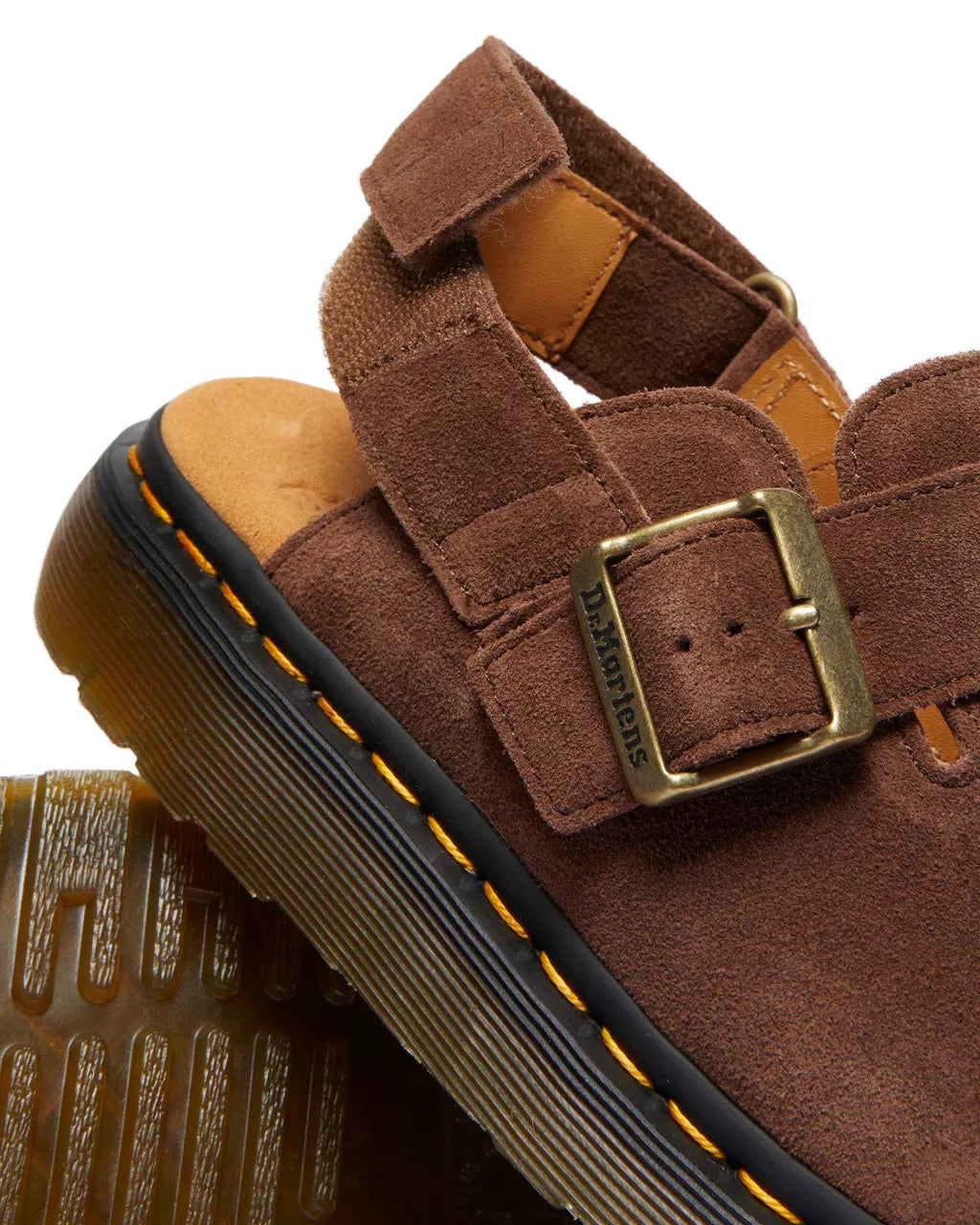 A brown suede mule sandal from Dr. Martens.