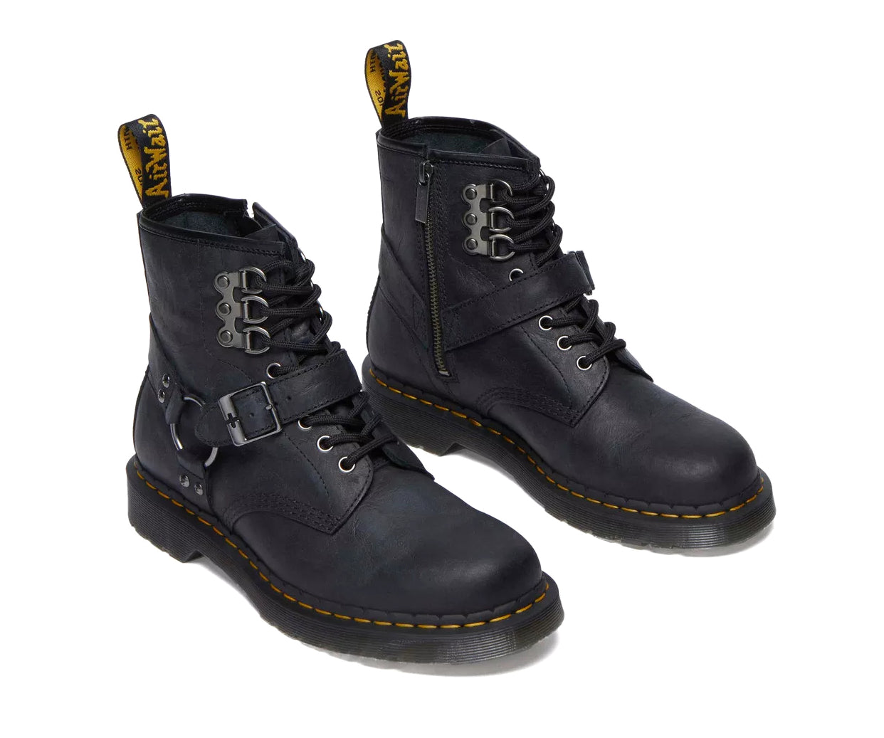 A black leather boot from Dr. Martens with additional straps and buckles.