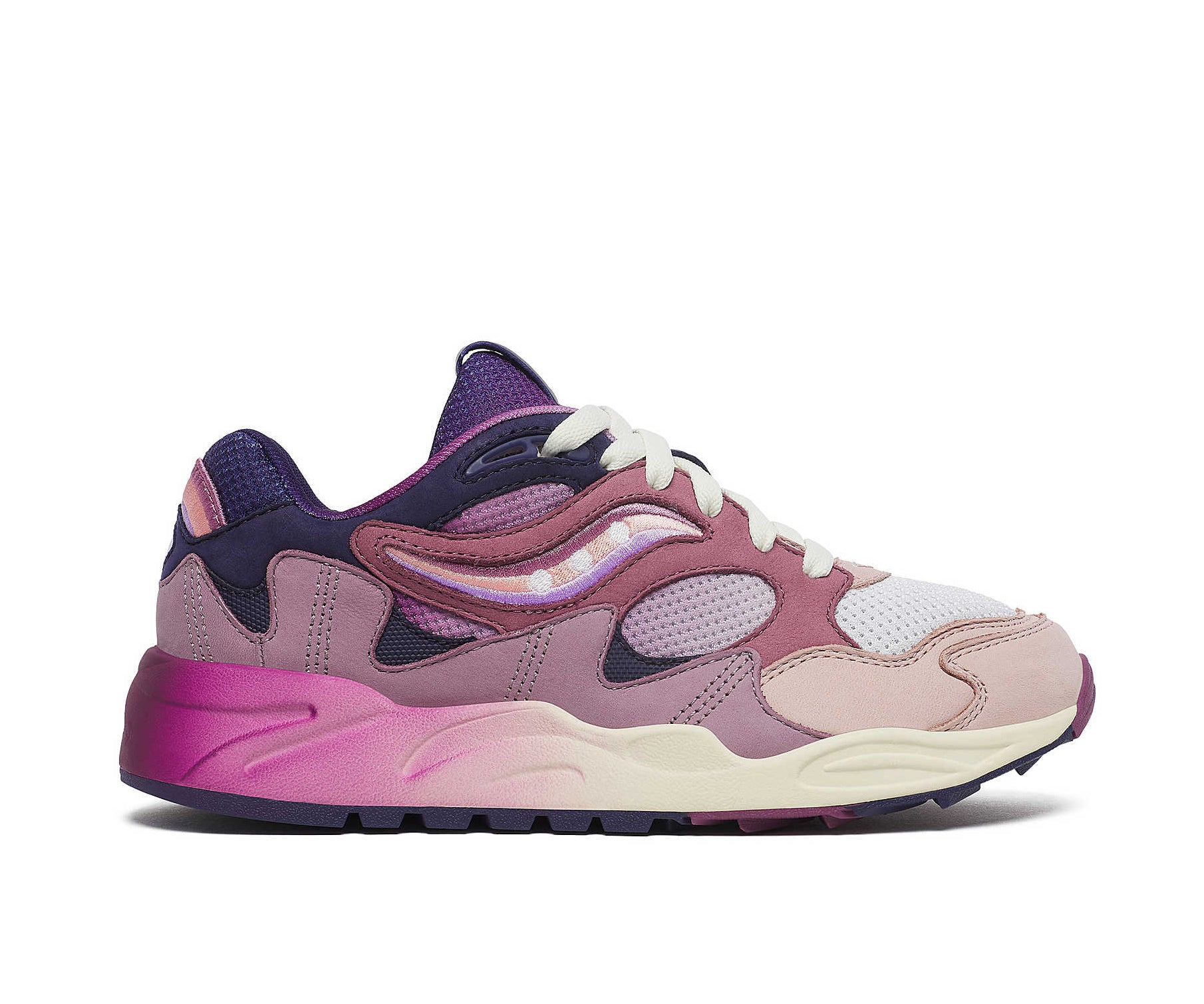 A purple sneaker from Saucony with dark blue accents and a magenta to white gradient.