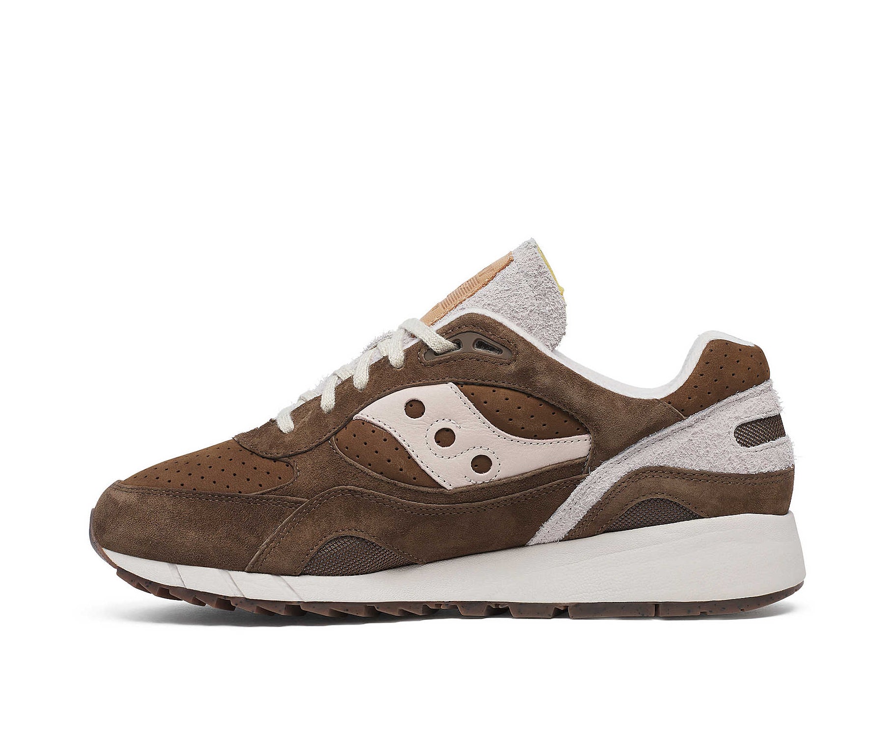 A brown suede sneaker with light cream accents from Saucony.