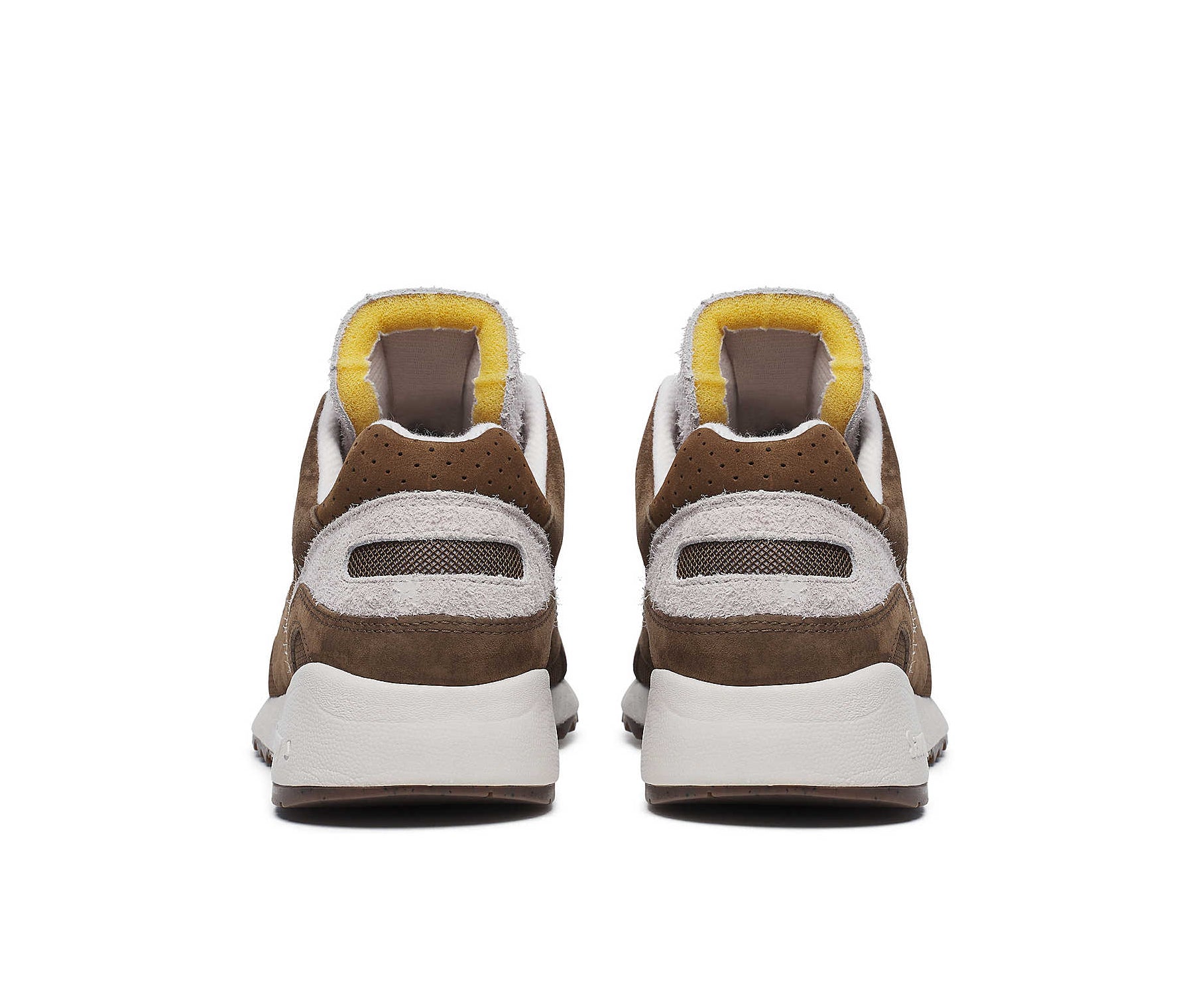 A brown suede sneaker with light cream accents from Saucony.