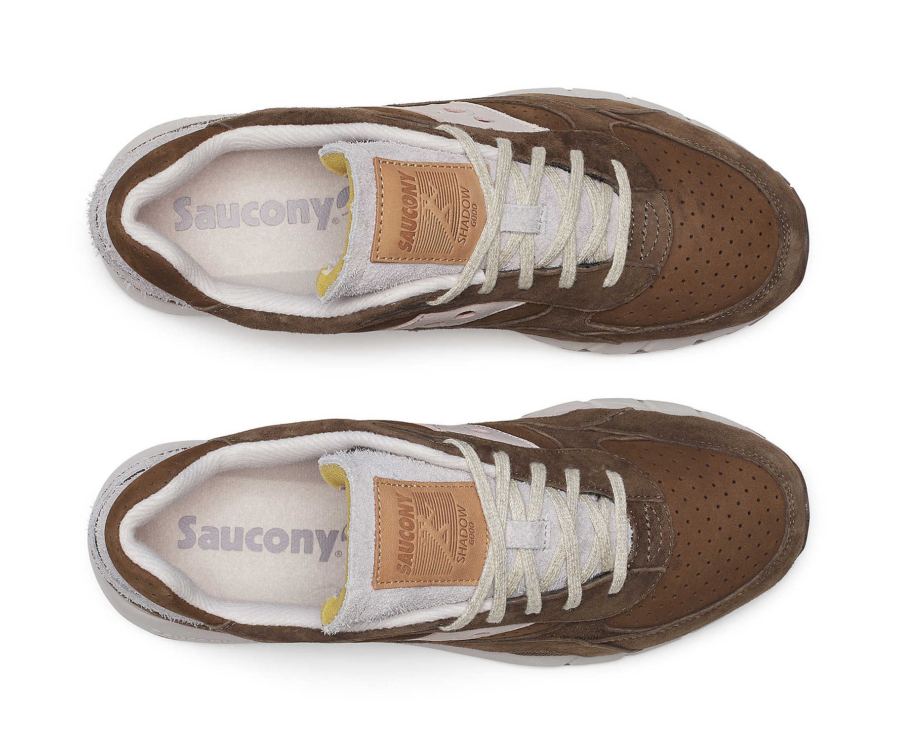 A brown suede sneaker with light cream accents from Saucony.