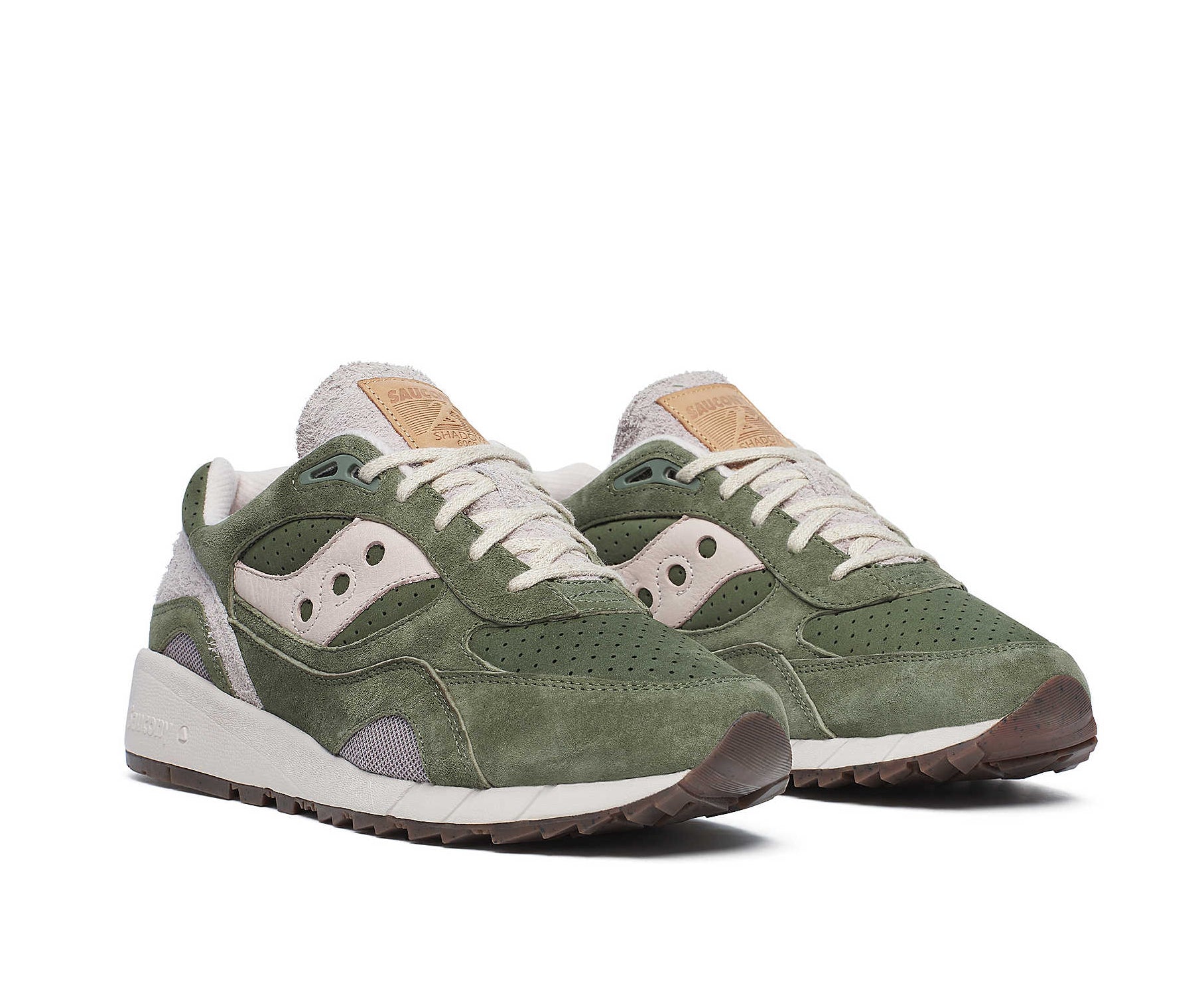 A green suede sneaker with light gray accents from Saucony.