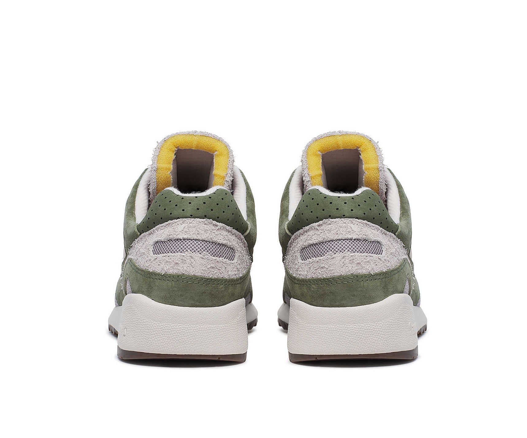 A green suede sneaker with light gray accents from Saucony.