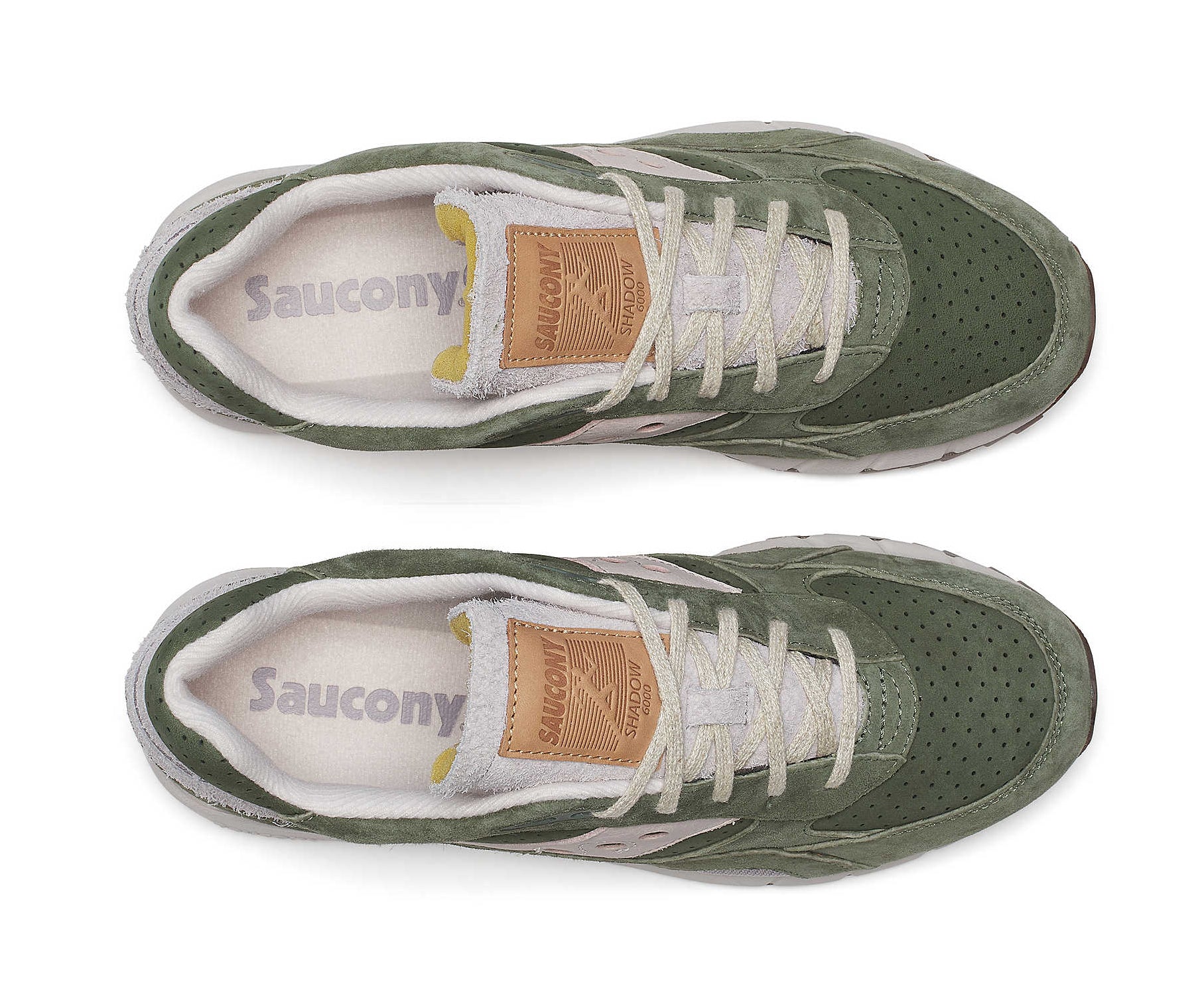 A green suede sneaker with light gray accents from Saucony.