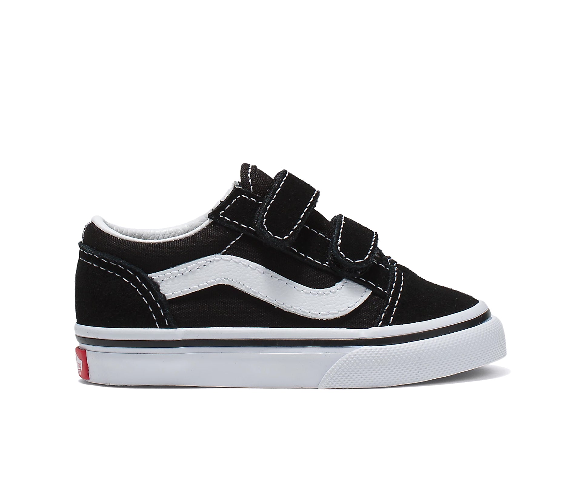 A black canvas and suede kids' sneaker with velcro straps.