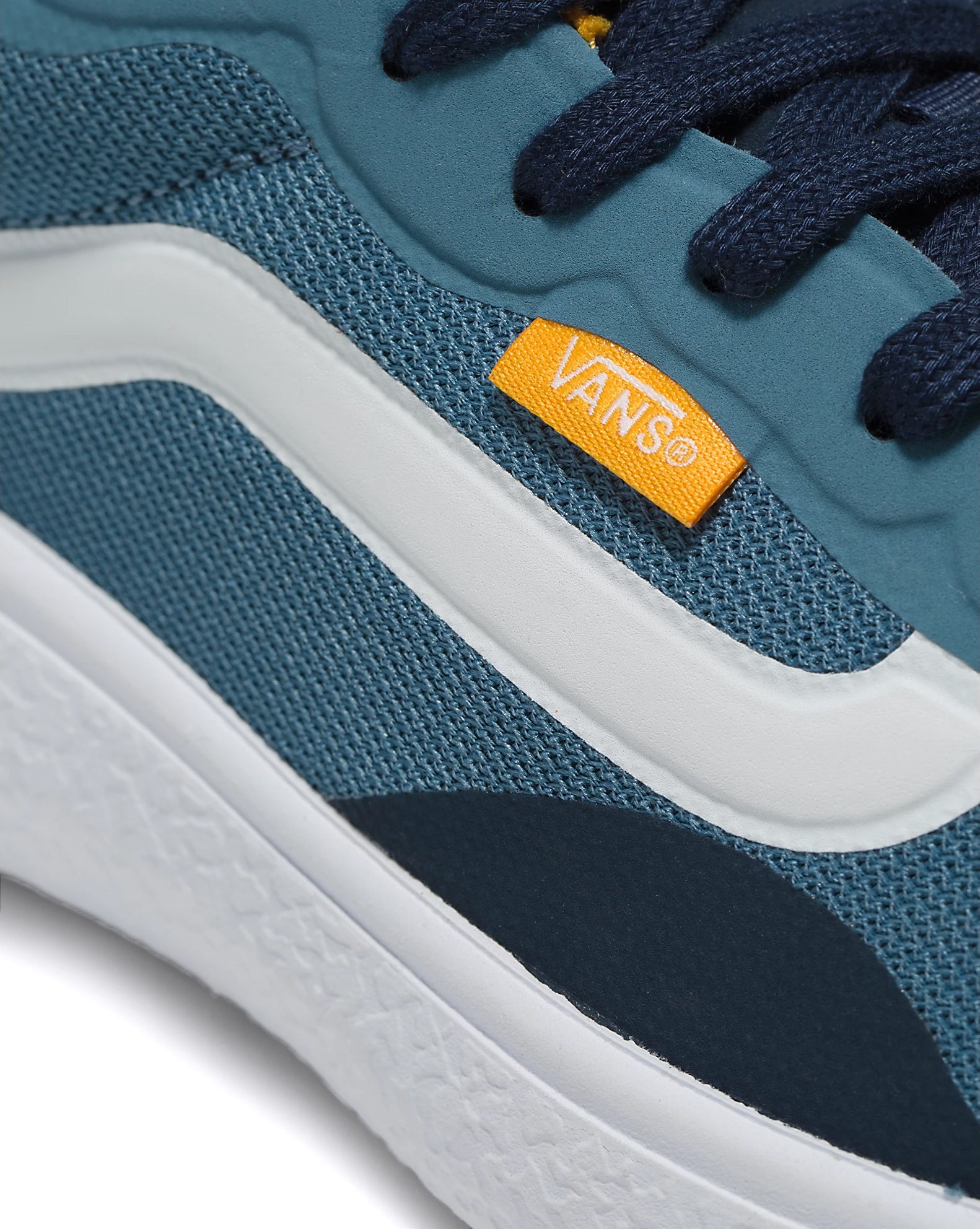 A teal and gold mesh low-top Vans sneaker.