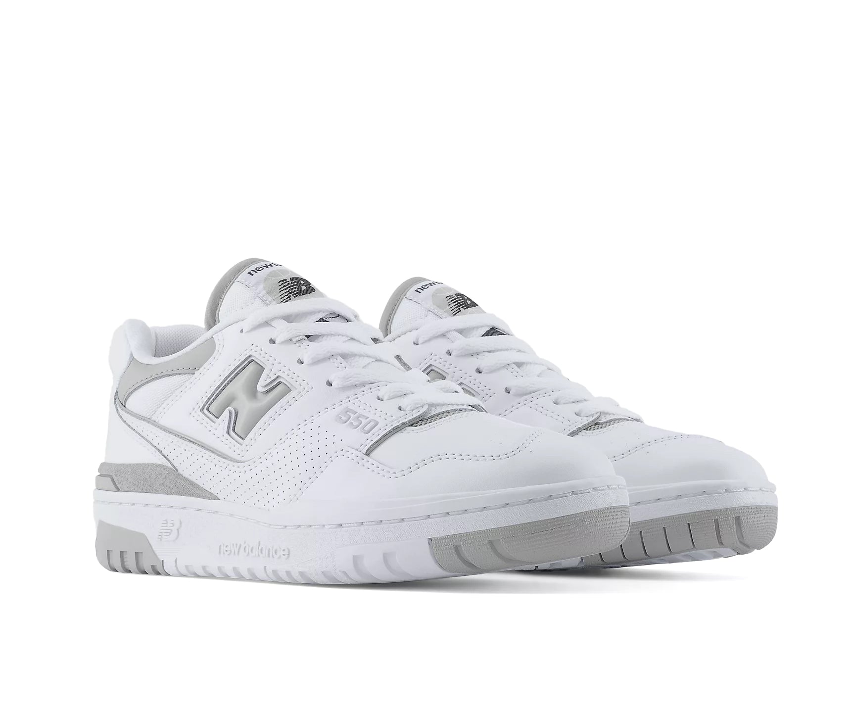 A white leather court shoe from New Balance with gray accents.