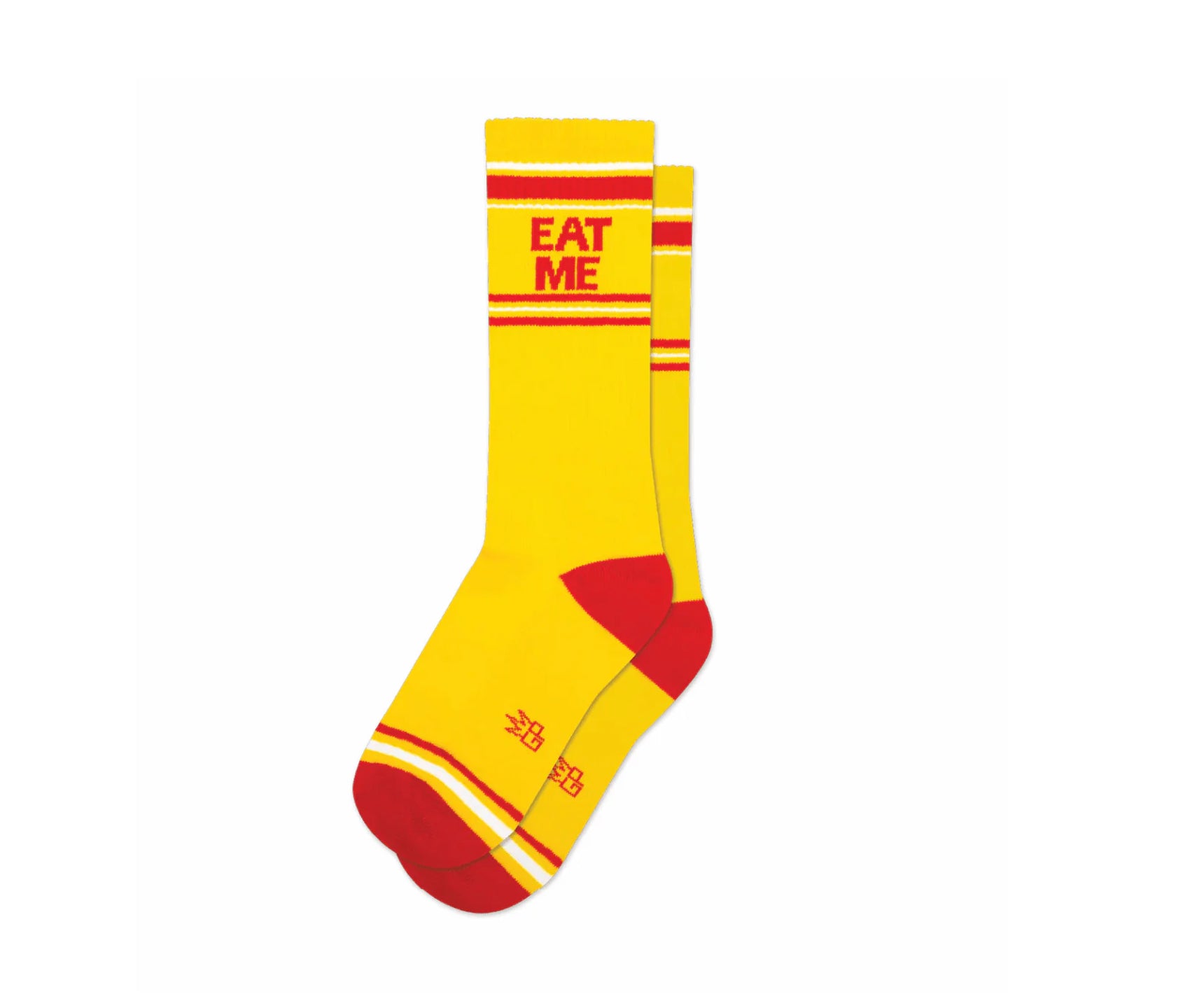 A pair of yellow and red crew socks that read "eat me" with the Gumball Poodle logo on the arch.