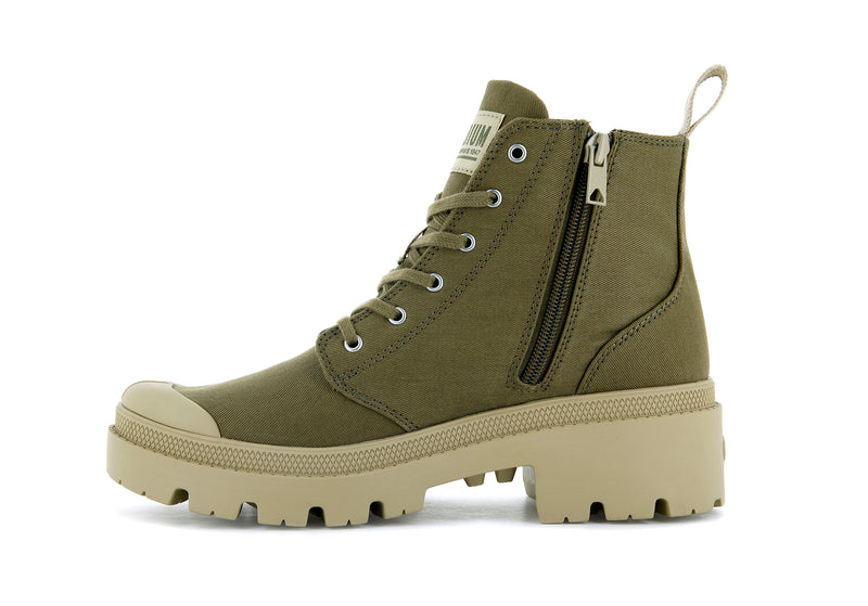 A green canvas boot from Palladium with tan accents.